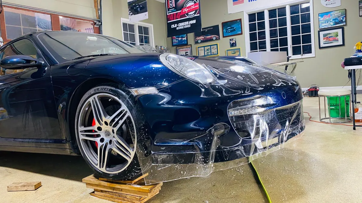 Paint protection film installation in progress.