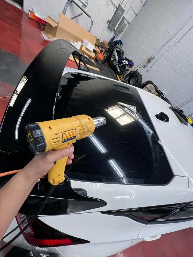 Black exterior vinyl detailing in progress.